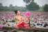 smiling-woman-holding-pink-lotus-1259430